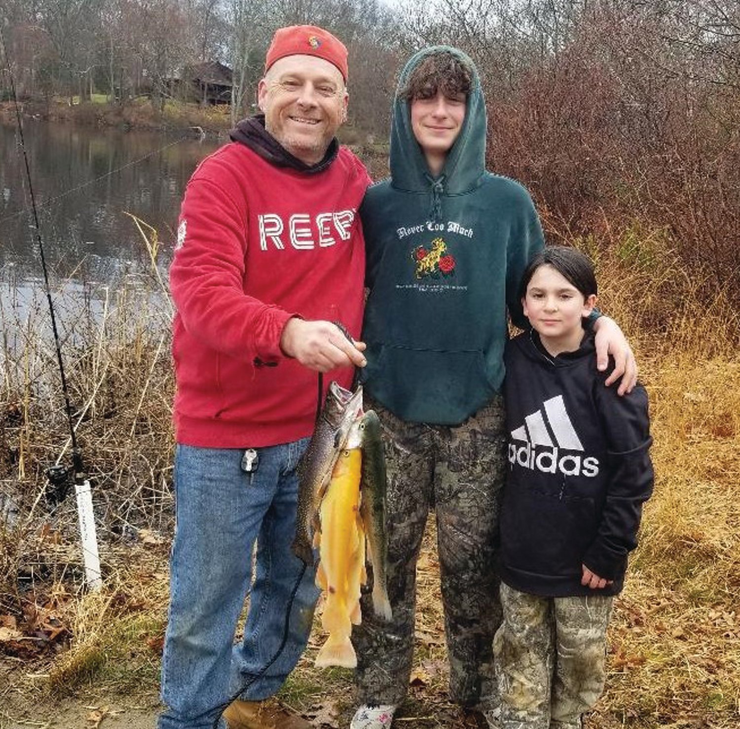 GOLDEN TROUT BIG HIT: Kevin Tierney of Burrillville fished with his stepsons Camryn Lions and Geo Curtis on opening day.  The trio caught seven trout including two golden trout.  (Submitted photo)